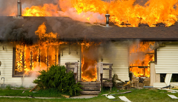 Front view of a house on fire